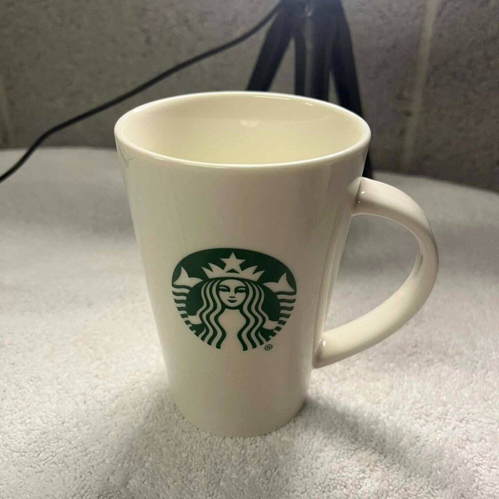 Starbucks cream ceramic coffee mug with classic green siren logo